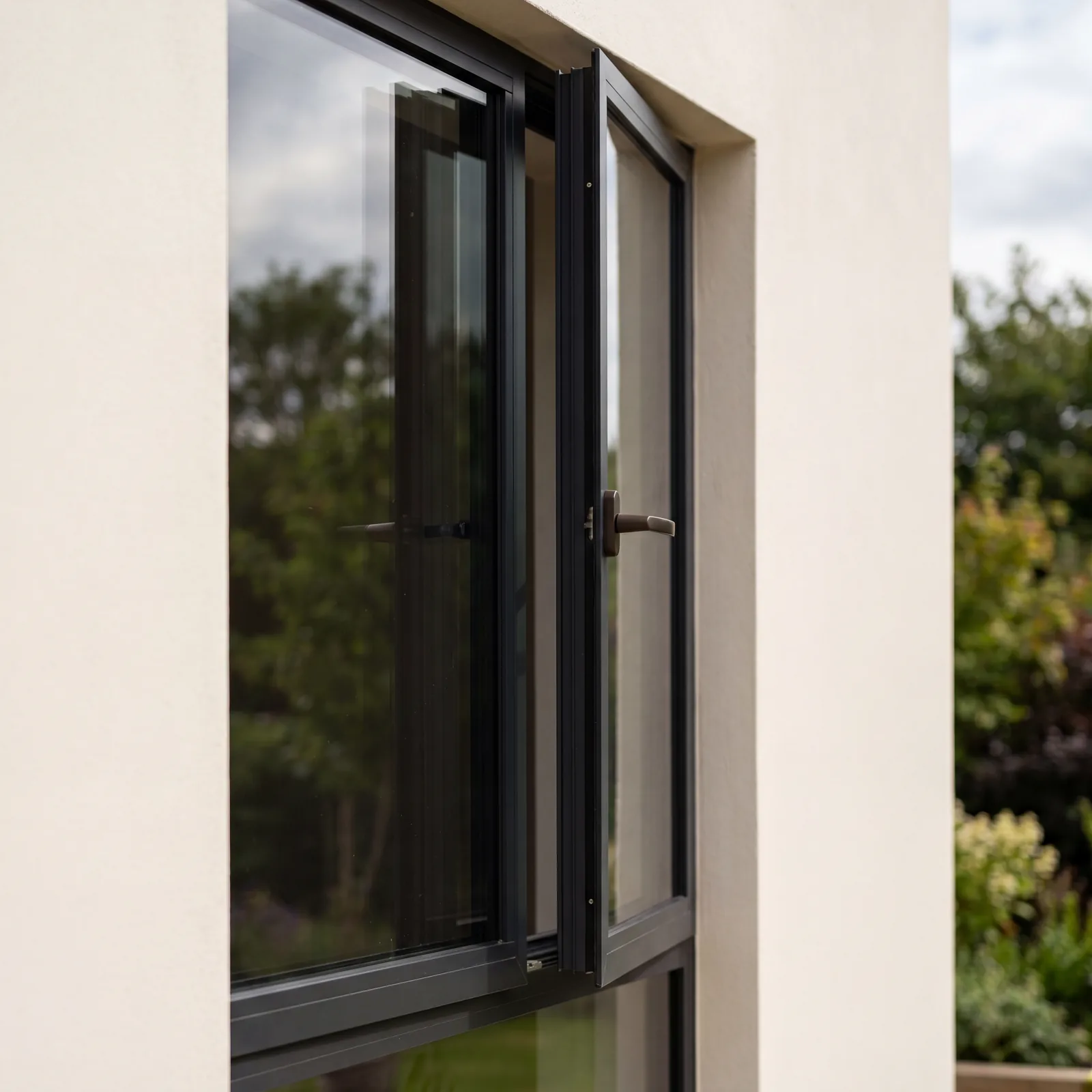 Slimline aluminium casement windows in a charcoal frame